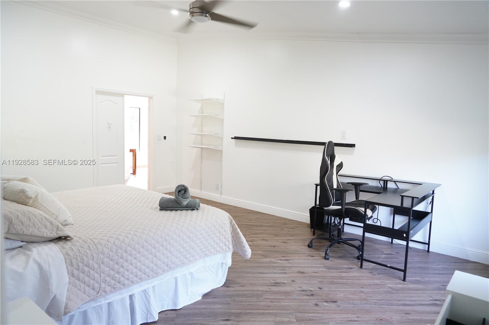 18901 Southwest 50th Street Southwest Ranches, FL 33332 - Photo 20 of 51 a bedroom with a bed and a table