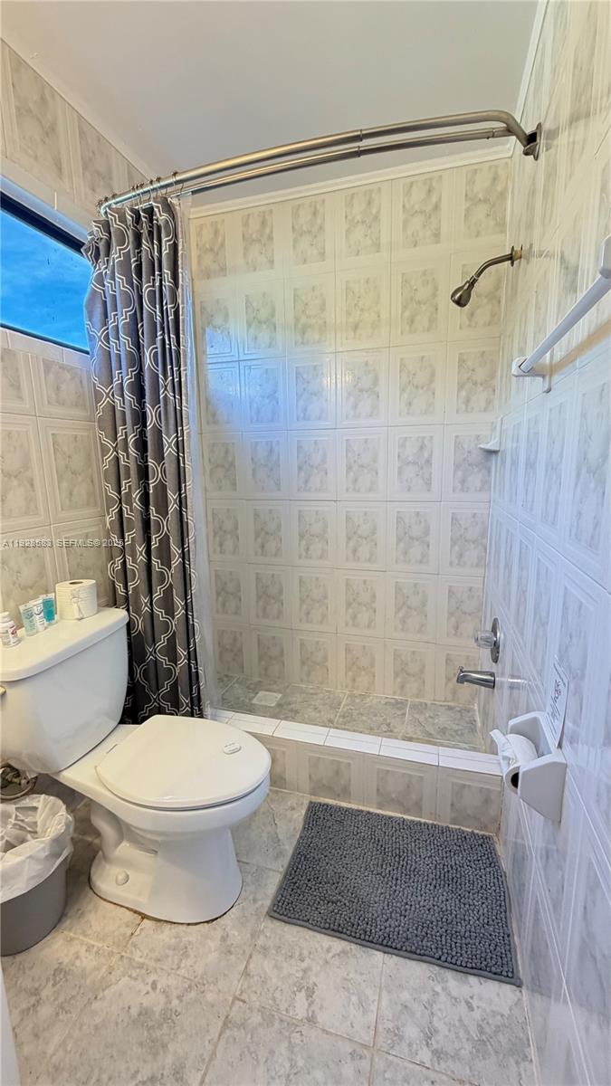 18901 Southwest 50th Street Southwest Ranches, FL 33332 - Photo 21 of 51 a bathroom with a toilet and a shower