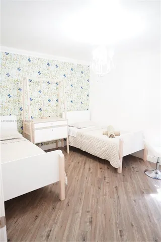 a room with a bed and a night stand