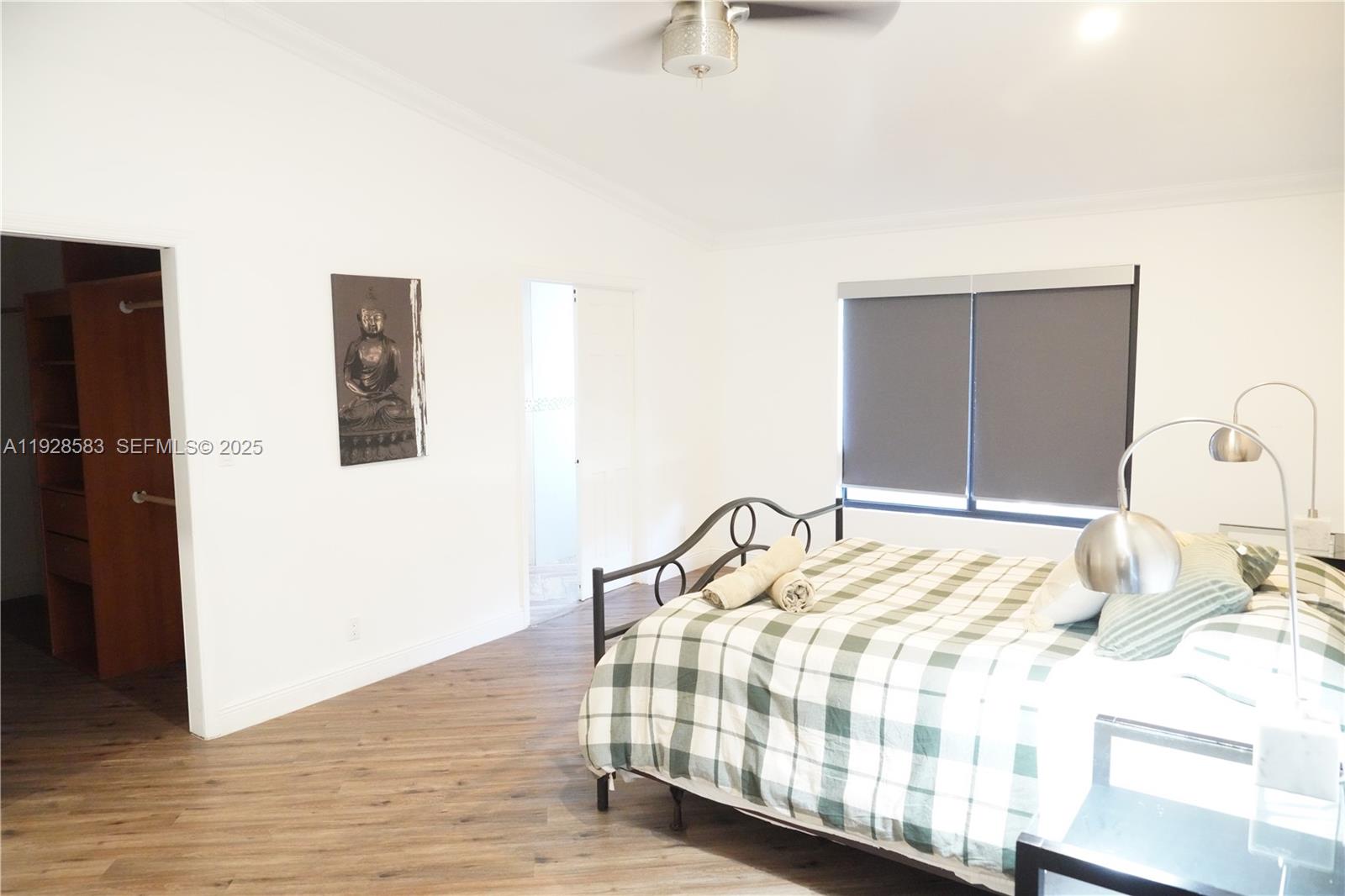 18901 Southwest 50th Street Southwest Ranches, FL 33332 - Photo 30 of 51 a bedroom with a bed and a dresser