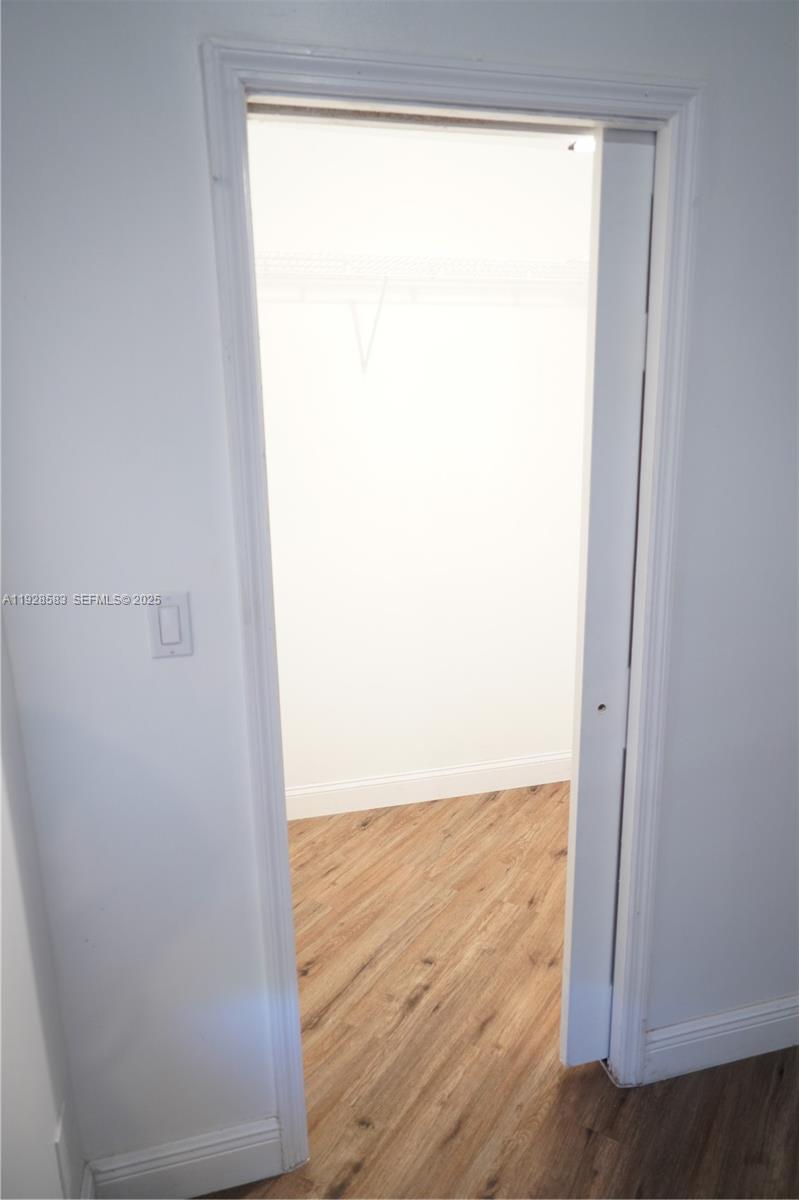 18901 Southwest 50th Street Southwest Ranches, FL 33332 - Photo 31 of 51 a view of a small space with wooden floor and a window