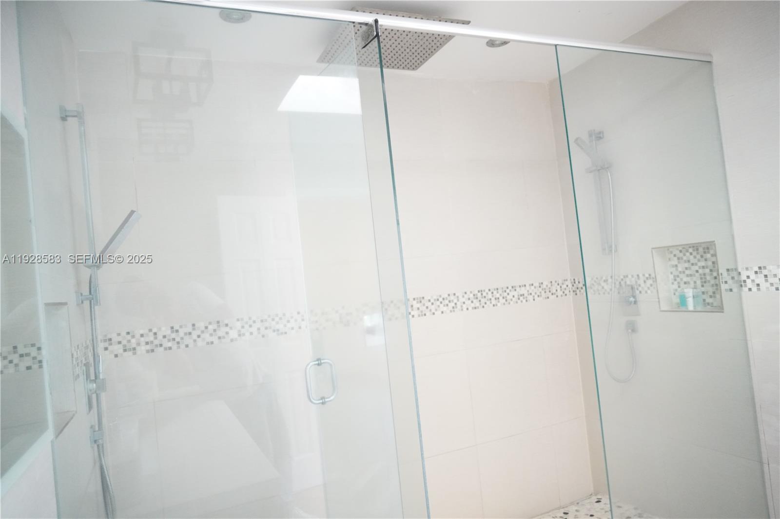 18901 Southwest 50th Street Southwest Ranches, FL 33332 - Photo 34 of 51 a bathroom with a glass shower door