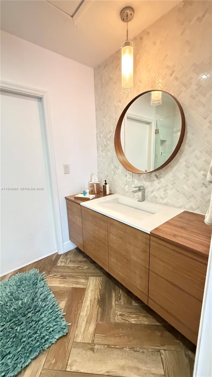 18901 Southwest 50th Street Southwest Ranches, FL 33332 - Photo 42 of 51 a bathroom with a sink mirror and vanity