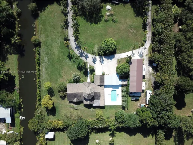 an aerial view of house with yard