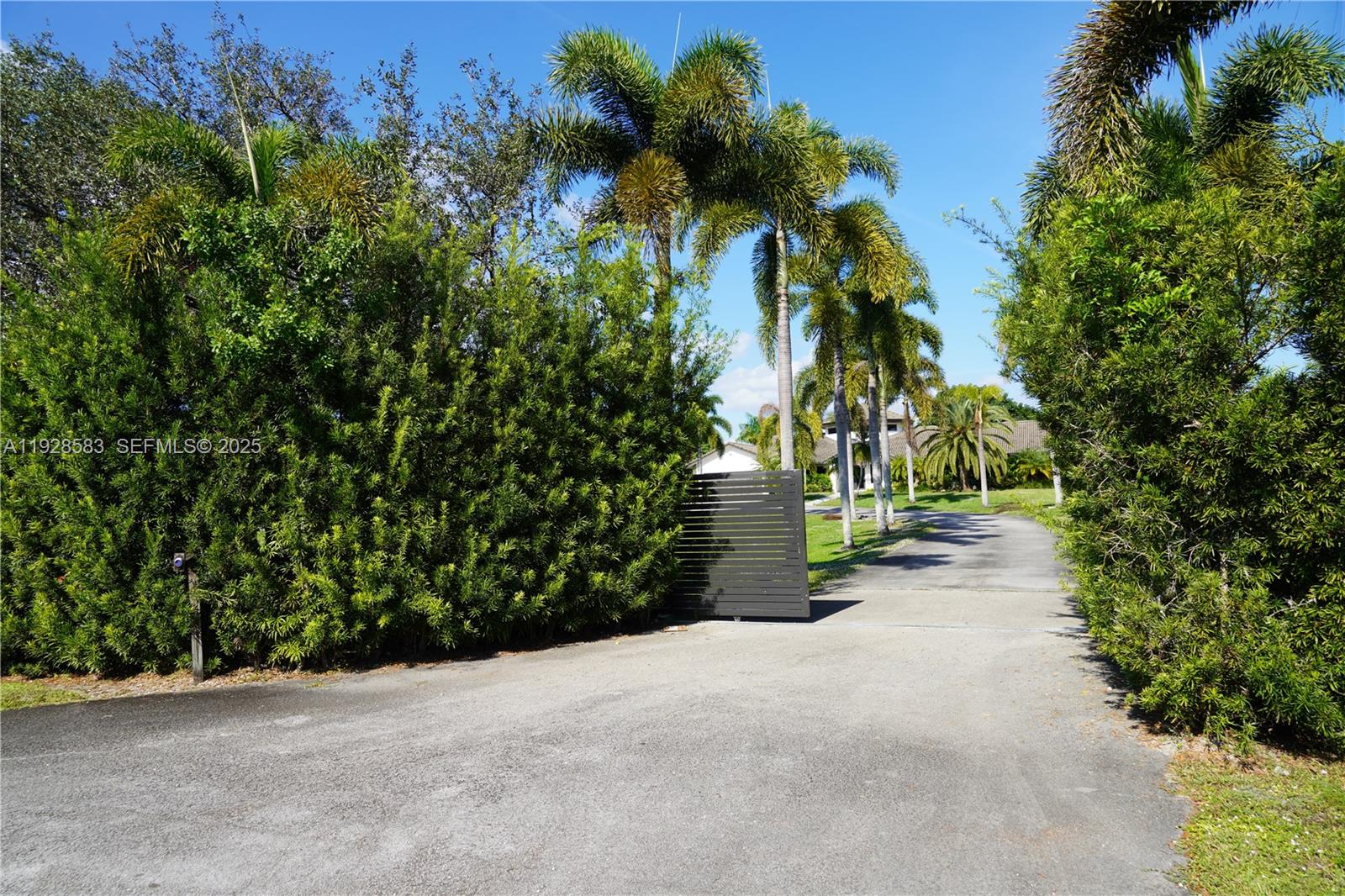18901 Southwest 50th Street Southwest Ranches, FL 33332 - Photo 51 of 51 a view of a road with a bench