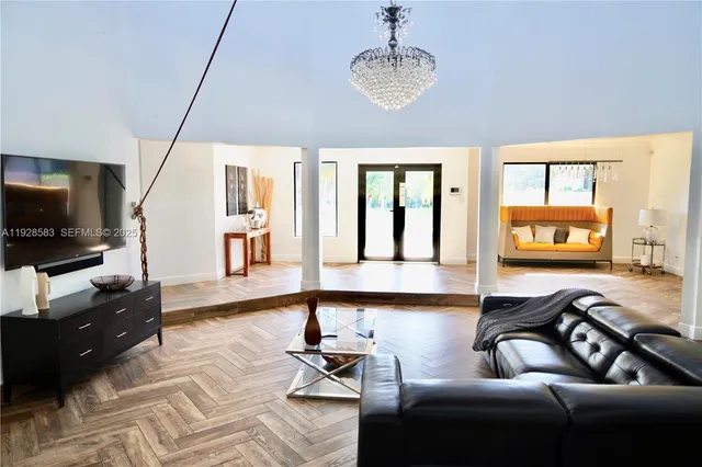 a living room with furniture and a flat screen tv