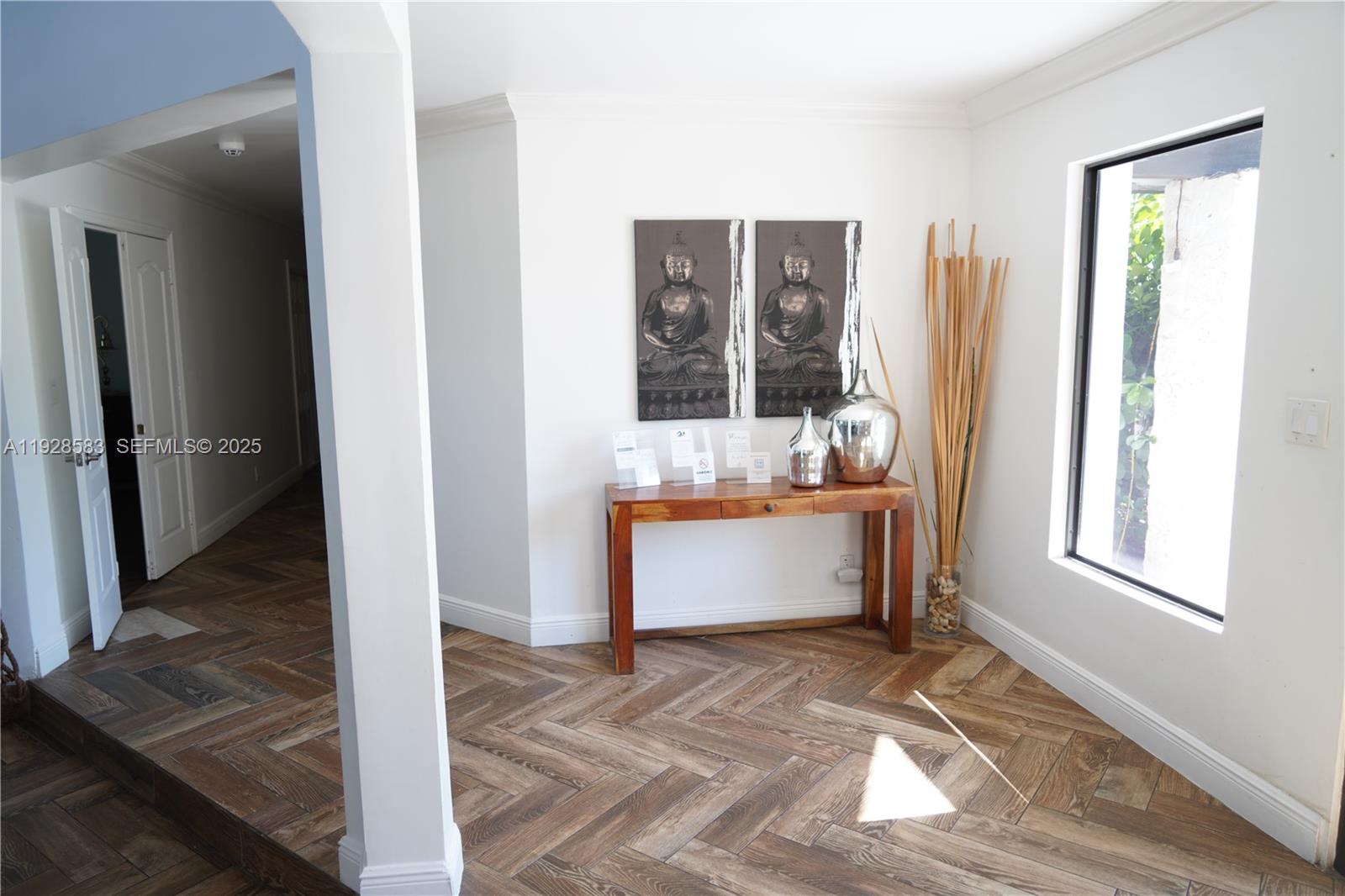 18901 Southwest 50th Street Southwest Ranches, FL 33332 - Photo 9 of 51 a view of an empty room with wooden floor and a window