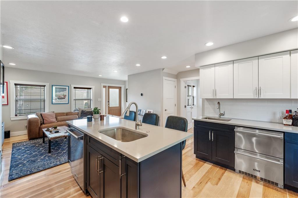 758 5th Street Beaver, PA 15009 - Photo 11 of 38 a kitchen with granite countertop a sink and cabinets