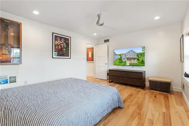 a bedroom with a bed and a dresser