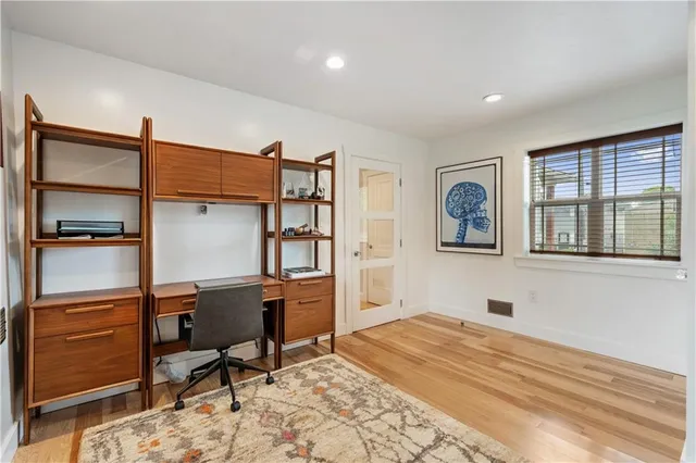 a workspace with furniture and window