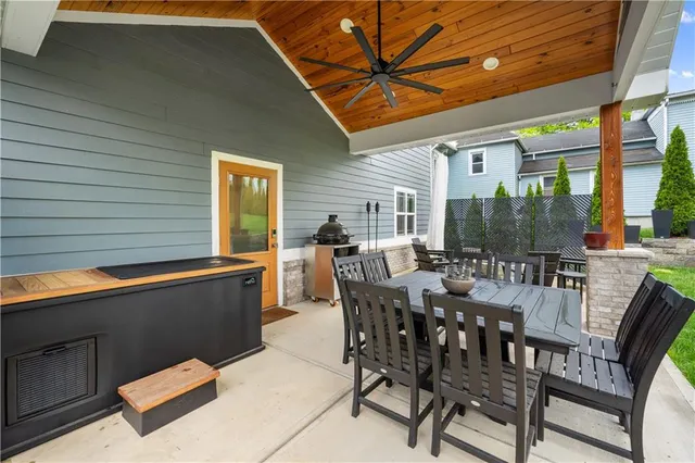 a view of a patio with table and chairs