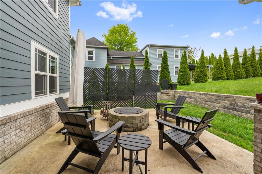 758 5th Street Beaver, PA 15009 - Photo 27 of 38 a view of a patio with table and chairs and potted plants with wooden floor and fence