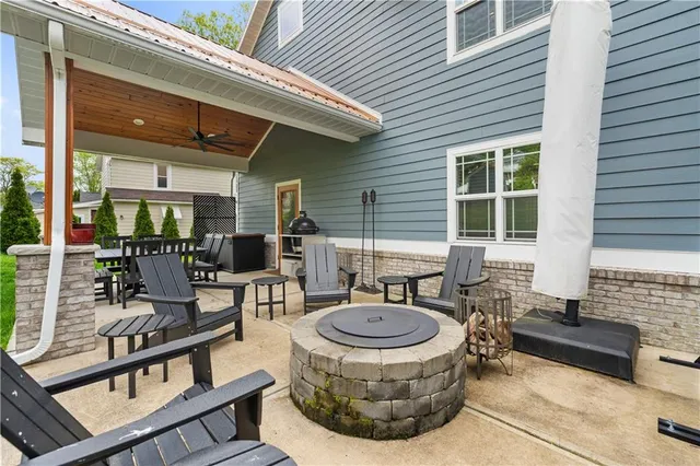 a view of house with outdoor seating