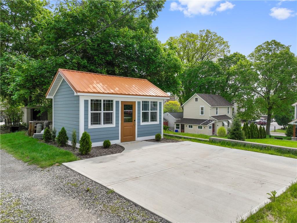 758 5th Street Beaver, PA 15009 - Photo 32 of 38 a front view of a house with a yard and trees