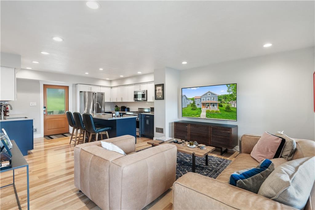 758 5th Street Beaver, PA 15009 - Photo 7 of 38 a living room with furniture and a flat screen tv