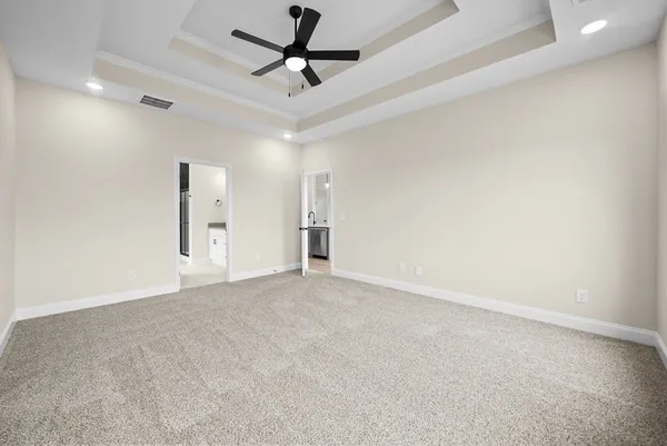 a view of a hallway with wooden floor and entryway