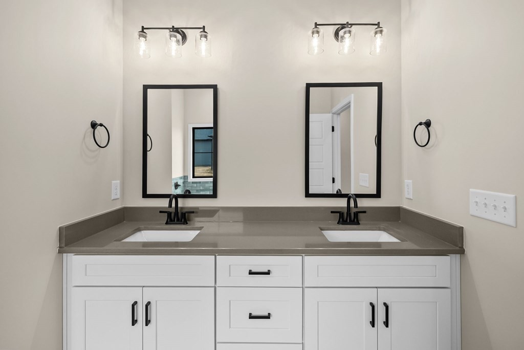 416 Old Major Road Hopkinsville, KY 42240 - Photo 16 of 41 a bathroom with double vanity sinks and a mirror