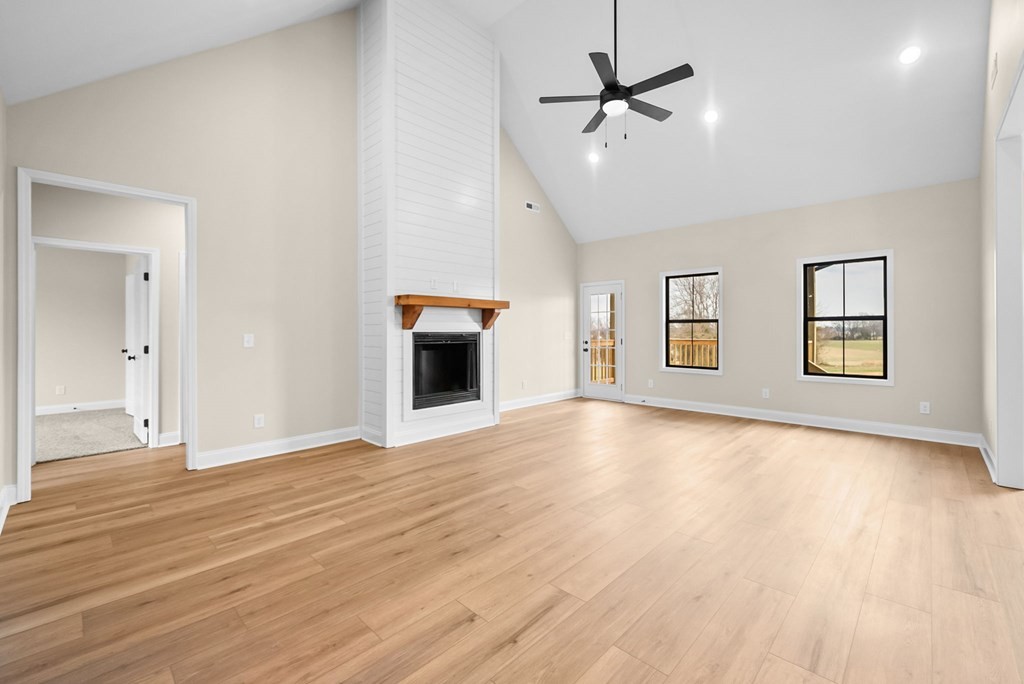 416 Old Major Road Hopkinsville, KY 42240 - Photo 3 of 41 a view of an empty room with window and wooden floor