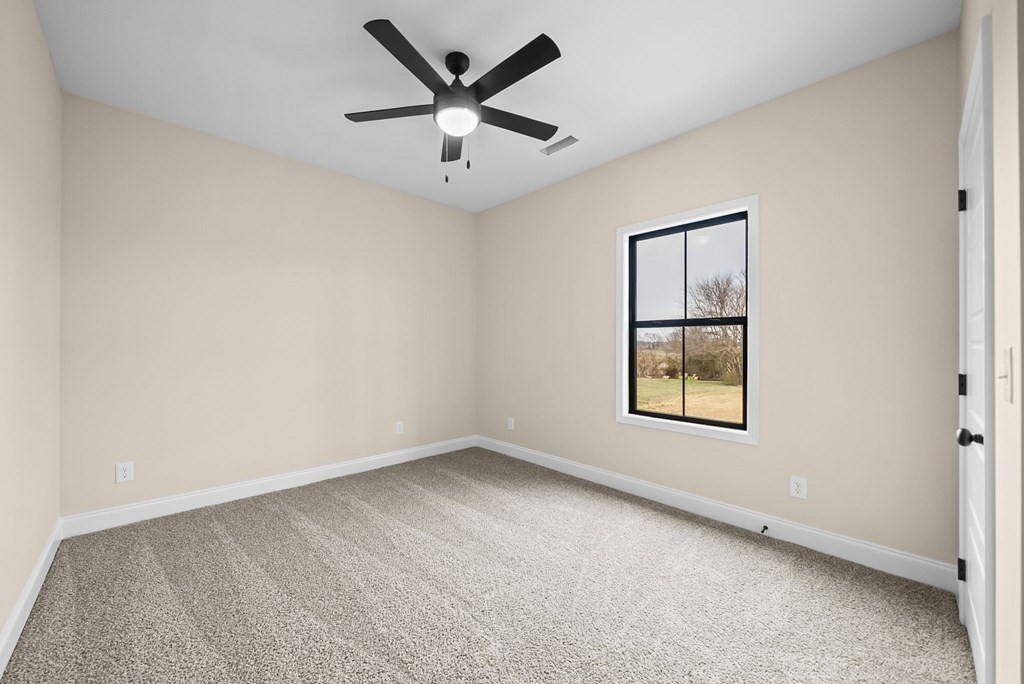 416 Old Major Road Hopkinsville, KY 42240 - Photo 32 of 41 an empty room with a window and a ceiling fan