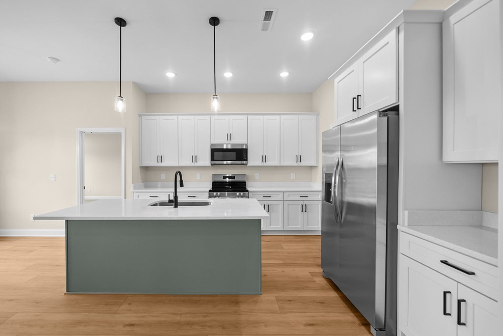 416 Old Major Road Hopkinsville, KY 42240 - Photo 10 of 41 a kitchen with kitchen island white cabinets and stainless steel appliances