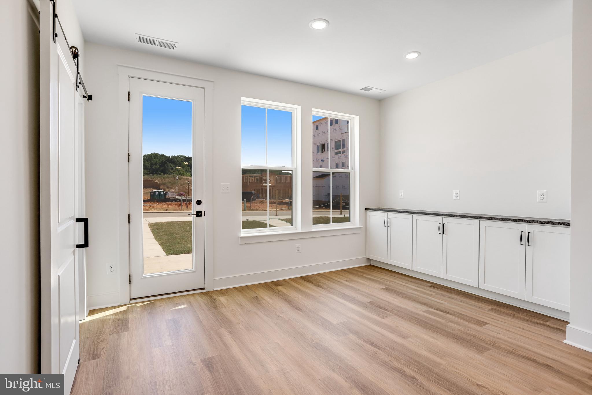 755 Elevation Road Frederick, MD 21702 - Photo 11 of 35 a view of an empty room with wooden floor and a window