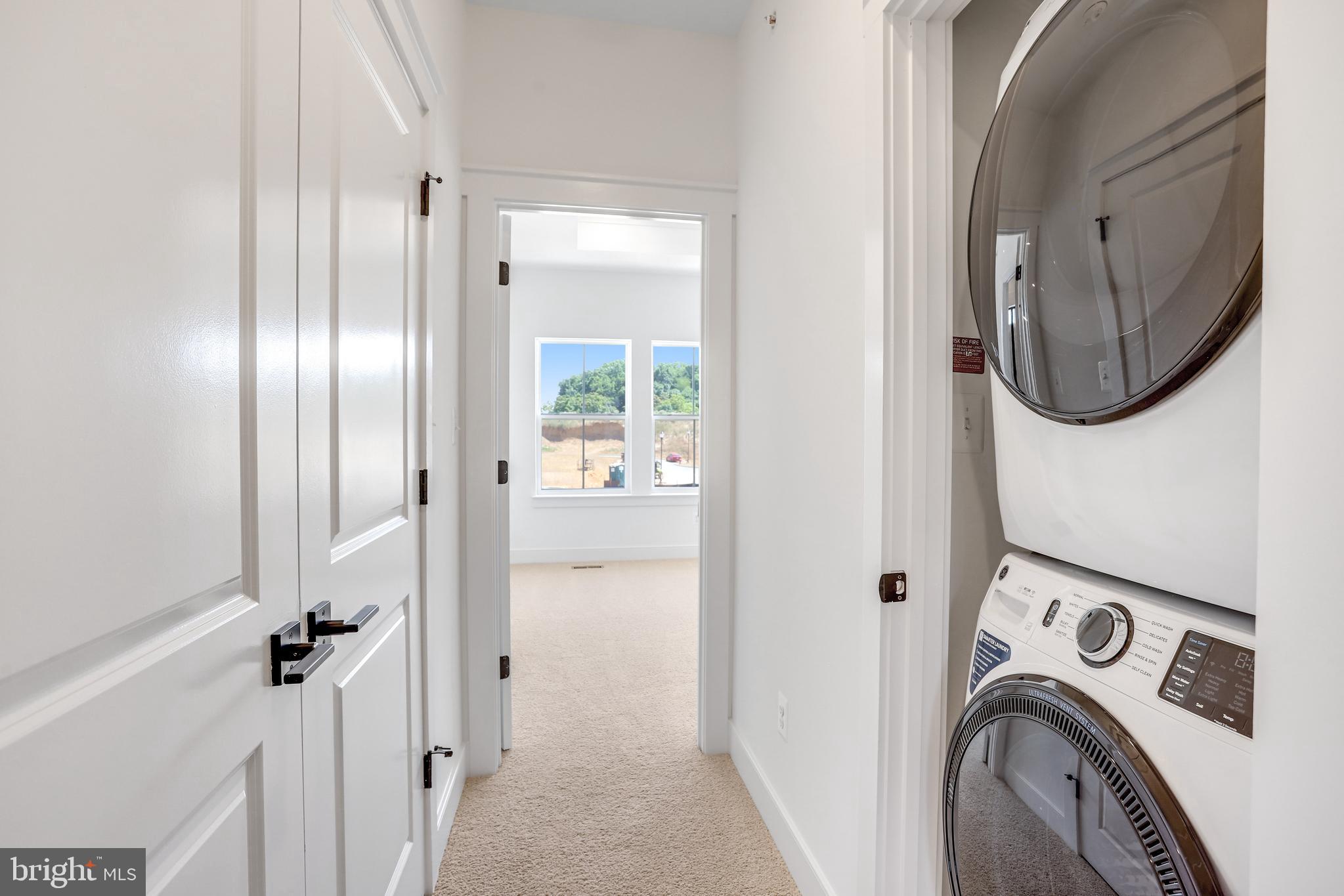 755 Elevation Road Frederick, MD 21702 - Photo 25 of 35 a view of a hallway with washer and dryer