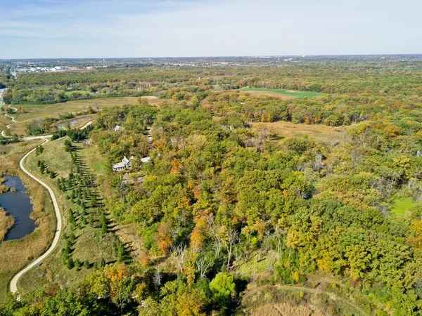 an aerial view of residential houses with outdoor space