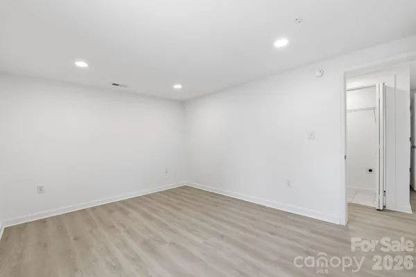 a view of backyard of house with green space