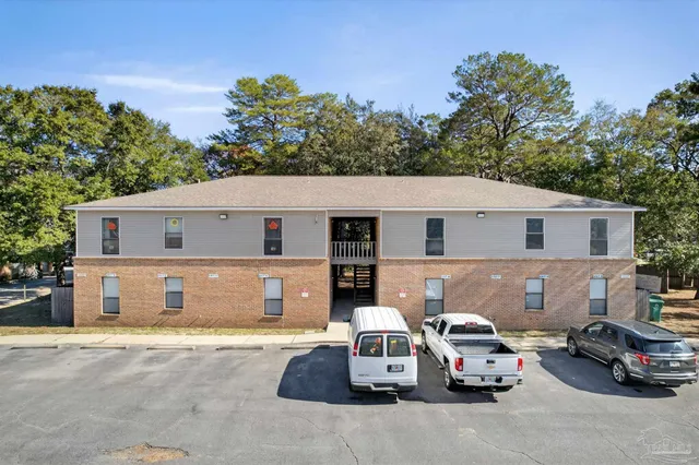 a view of a car parked in front of a house