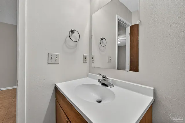 a bathroom with a bath tub with a shower