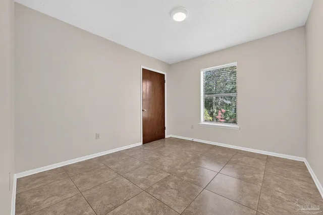 wooden floor in a room with a bathroom