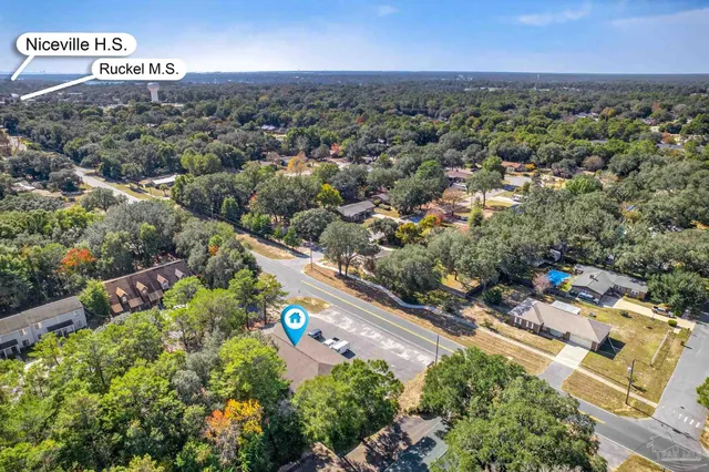 an aerial view of house with yard