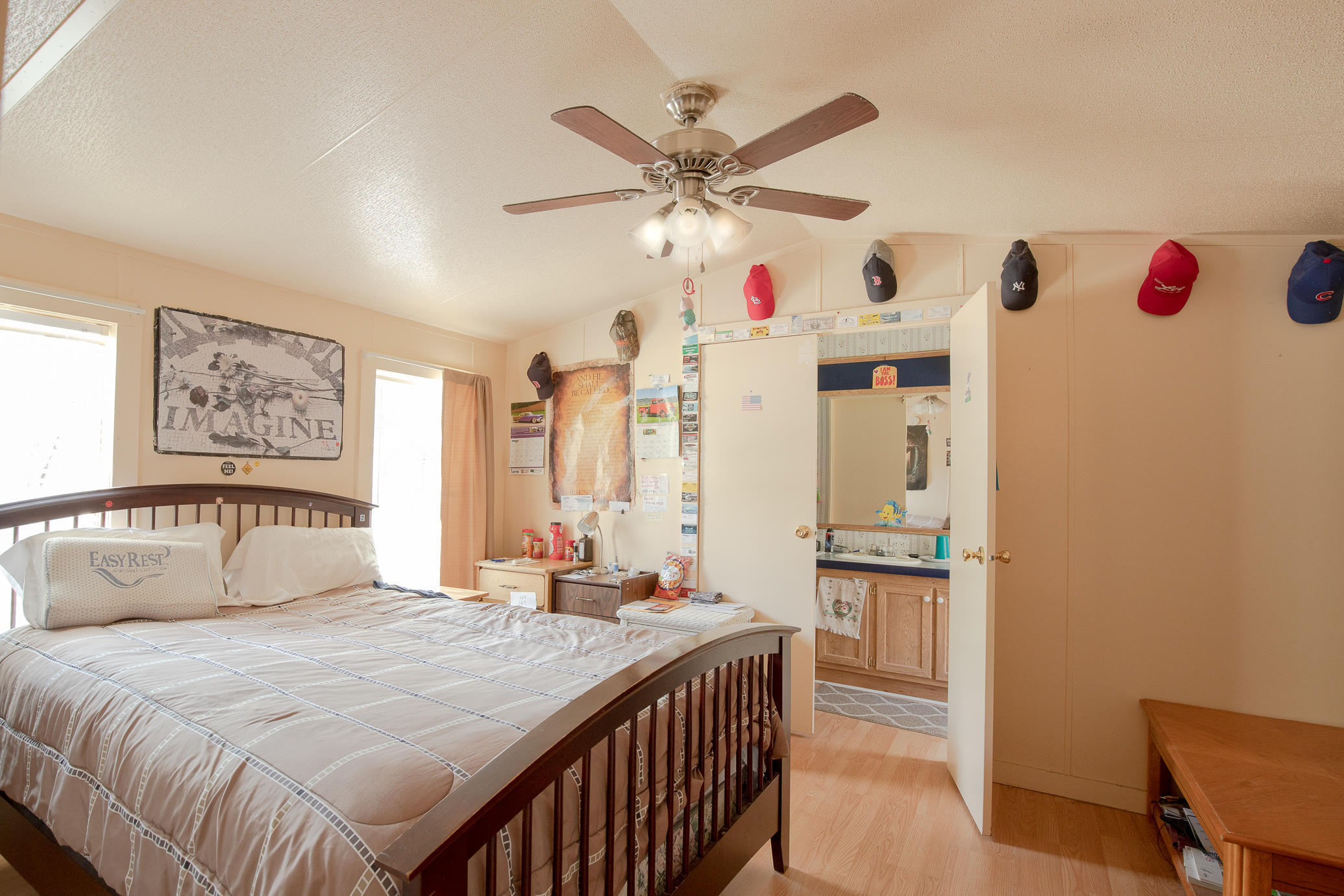 973 Valley Road Crestview, FL 32539 - Photo 7 of 20 a bedroom with a bed and a chandelier