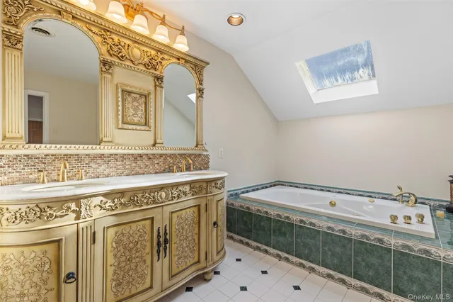 a bathroom with a sink a vanity and a mirror