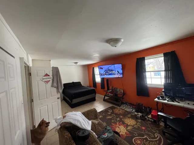 a livingroom with furniture and a window