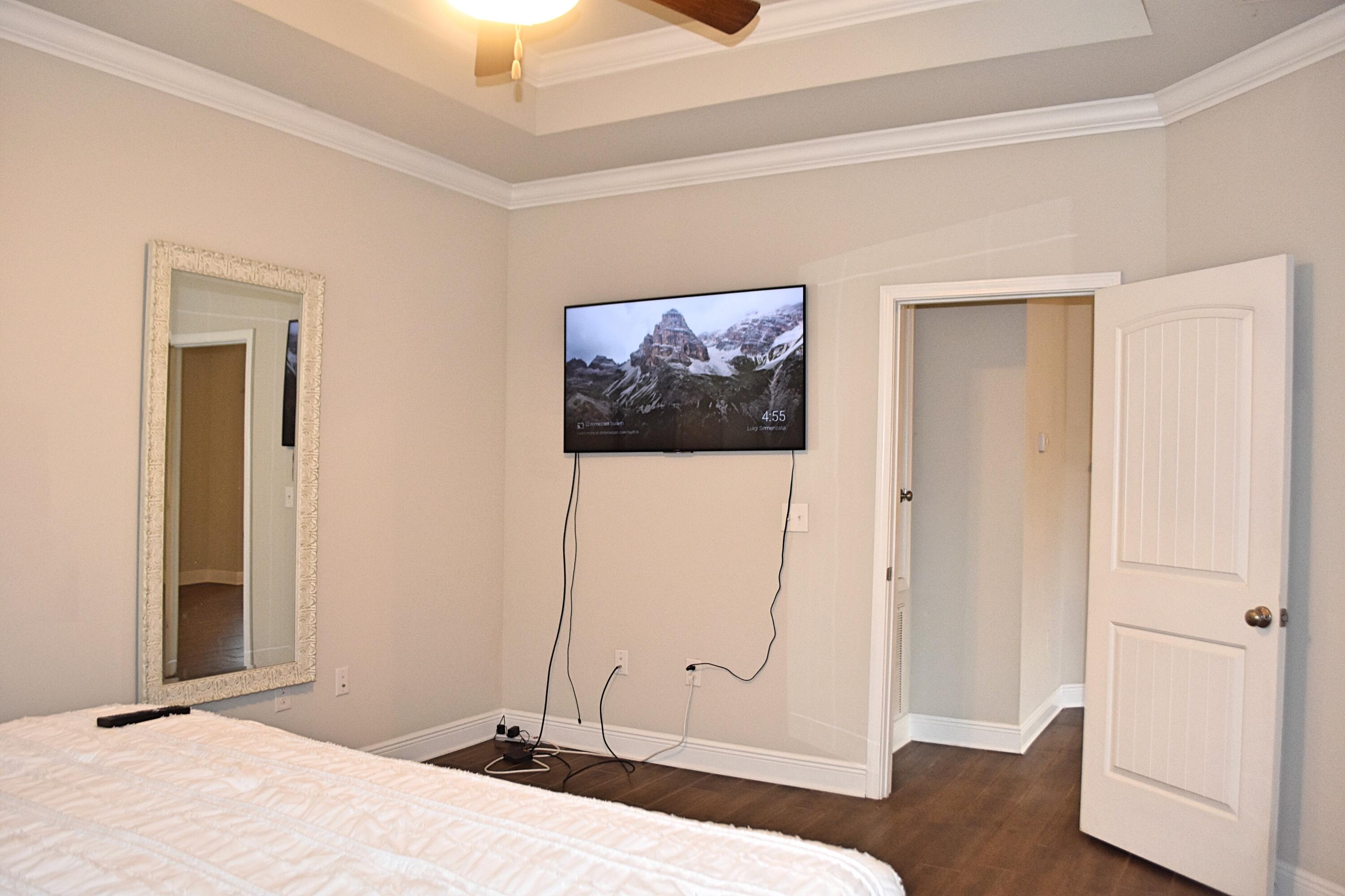 41 Twain Trail Freeport, FL 32439 - Photo 16 of 24 a bedroom with a bed and a refrigerator