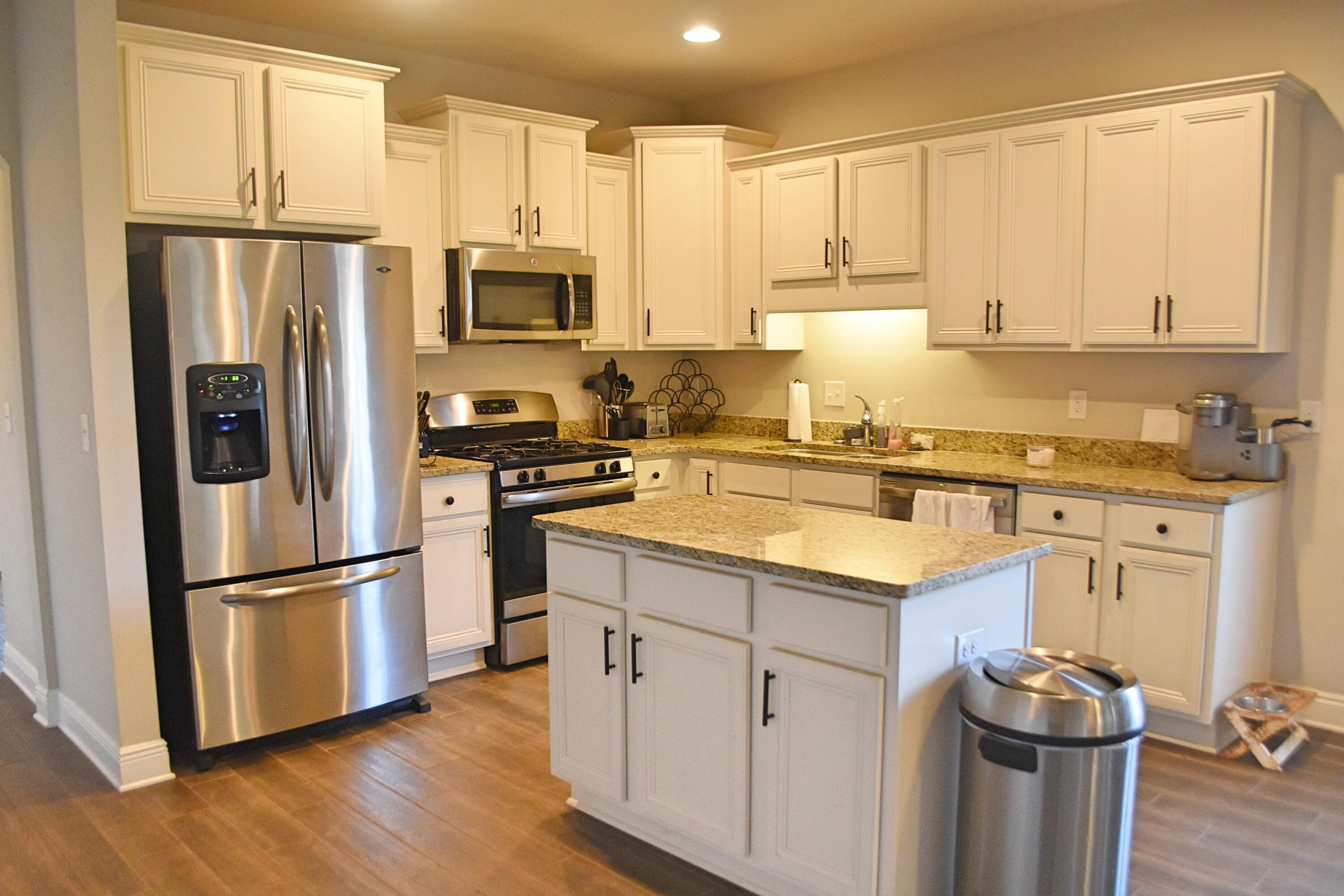 41 Twain Trail Freeport, FL 32439 - Photo 7 of 24 a kitchen with stainless steel appliances granite countertop a refrigerator sink and cabinets