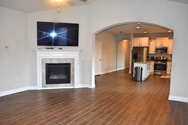 a living room with furniture and a fireplace