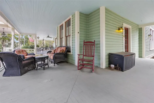 a view of entryway livingroom and hall with wooden floor