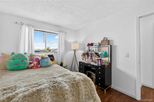 a bedroom with a bed and a closet