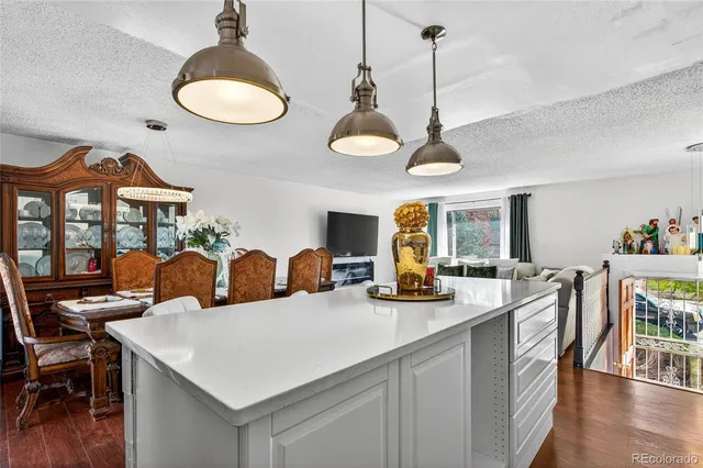 a view of a dining room furniture and wooden floor