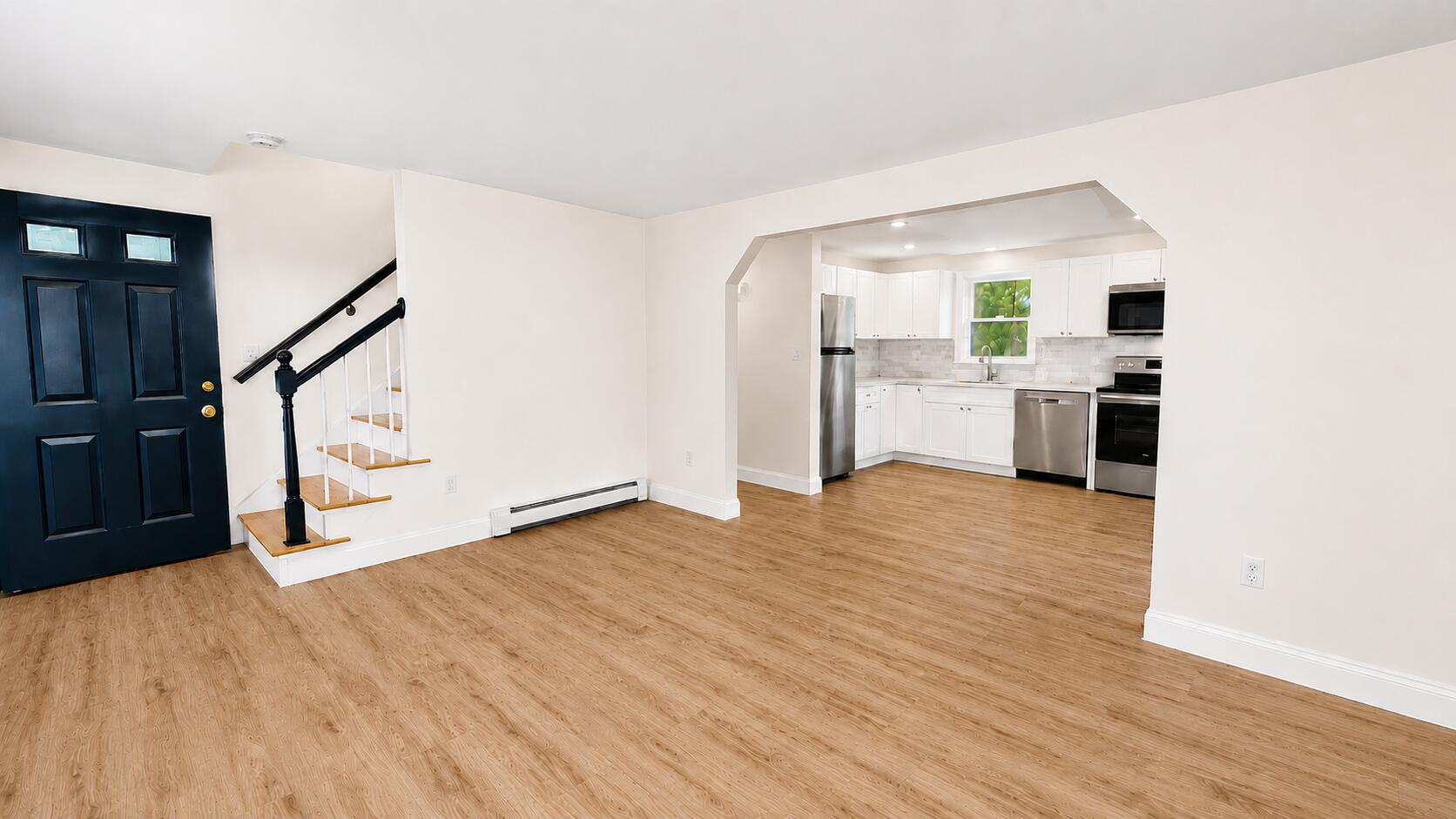 147 Chippingstone Road Marstons Mills, MA 02648 - Photo 9 of 23 a view of a kitchen with wooden floor and staircase