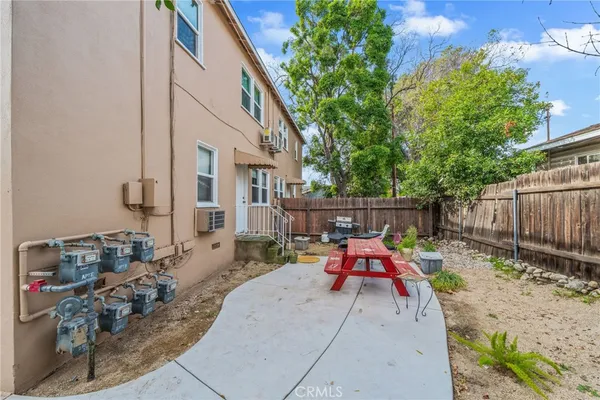 a view of backyard with small cabin