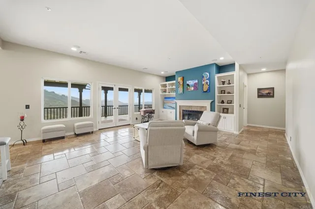 a bathroom with a granite countertop sink a mirror a bathtub and shower
