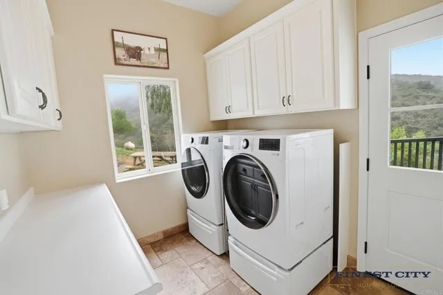 a bathroom with a sink double vanity and a toilet