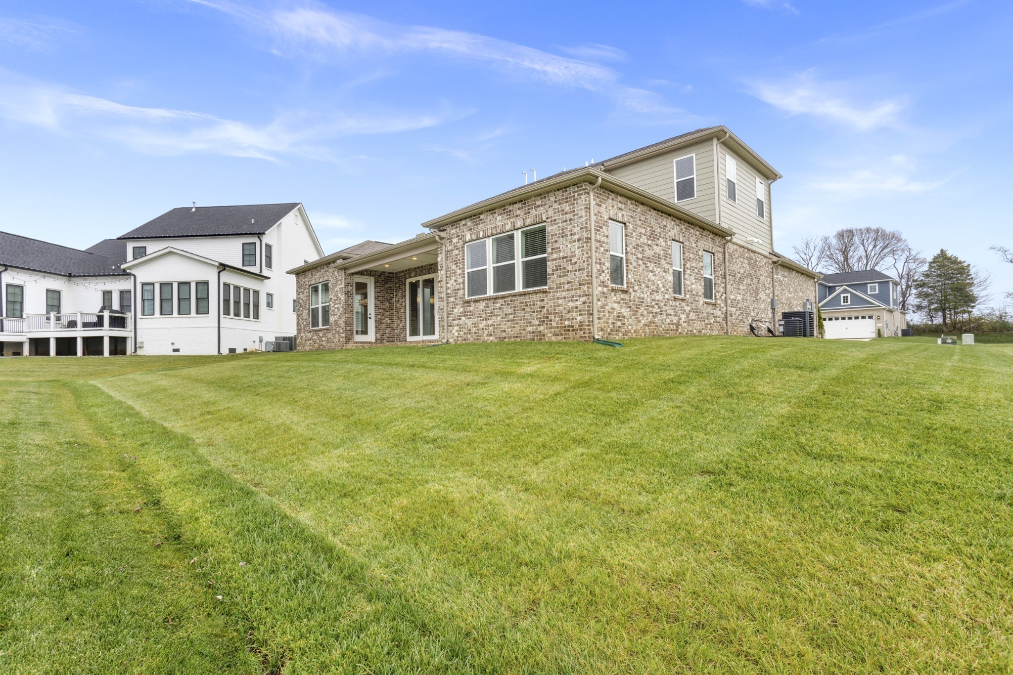 1939 Harmony Road Spring Hill, TN 37174 - Photo 42 of 50 a front view of a house with a garden and plants
