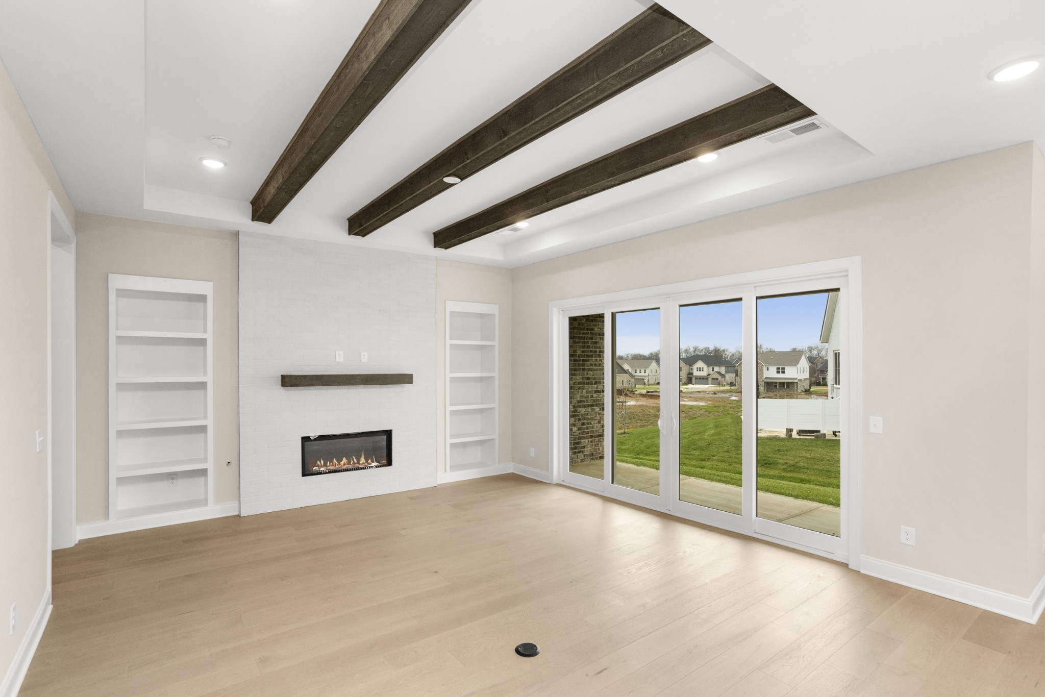 1939 Harmony Road Spring Hill, TN 37174 - Photo 8 of 50 a view of an empty room with a fireplace and a window