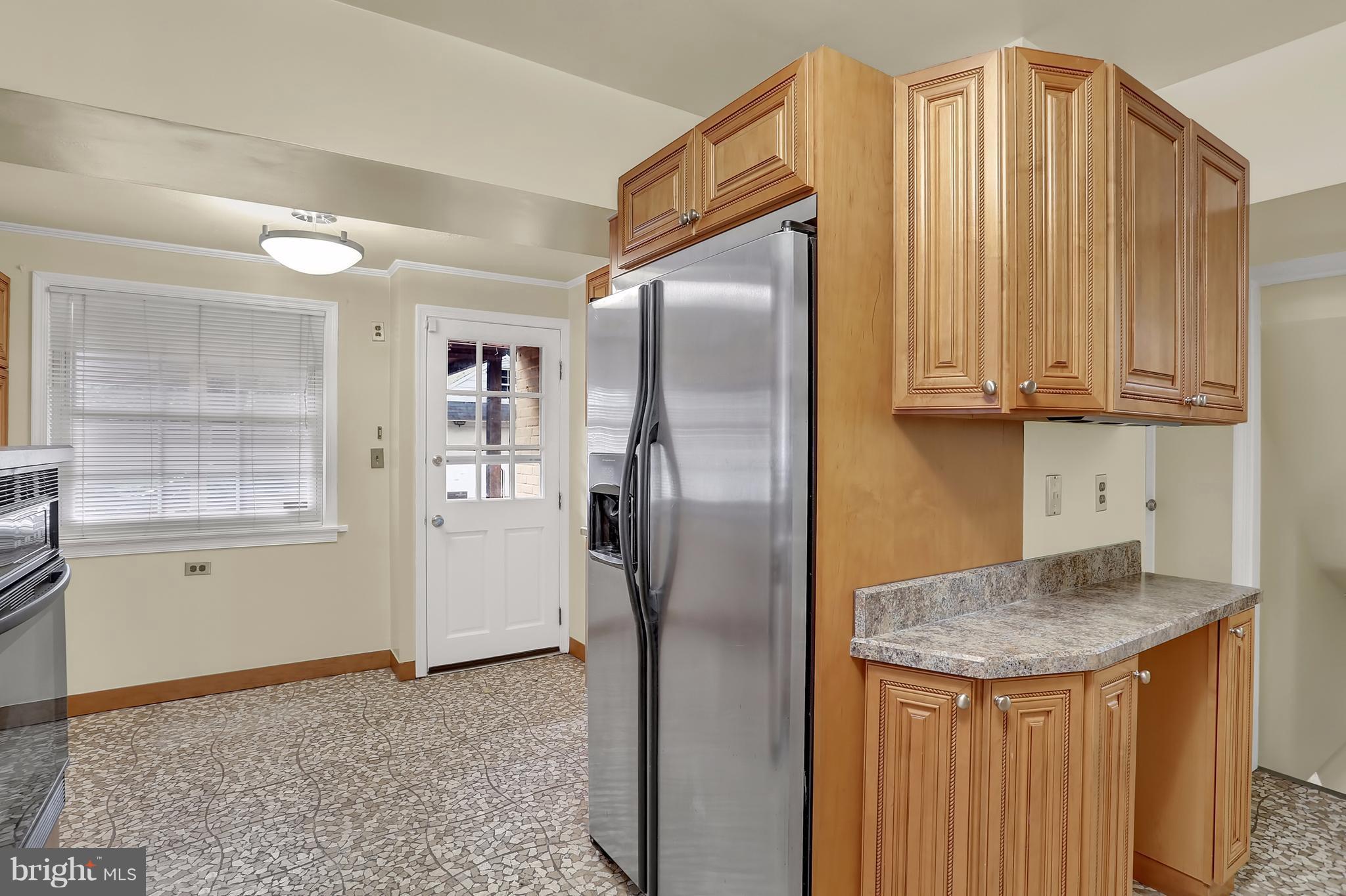 9408 Flower Avenue Silver Spring, MD 20901 - Photo 12 of 29 Kitchen and breakfast area with deck access