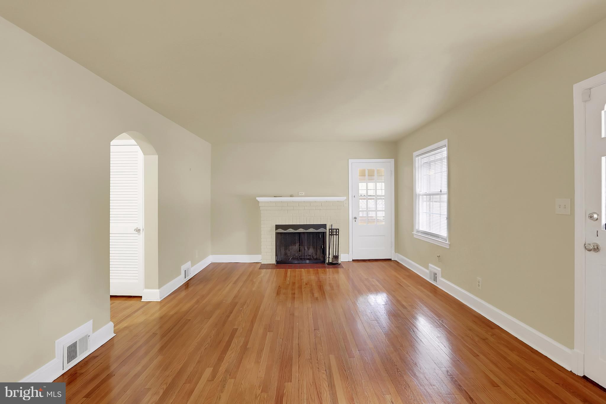 9408 Flower Avenue Silver Spring, MD 20901 - Photo 3 of 29 Bright and beautiful LR w/gleaming HW and cozy FP