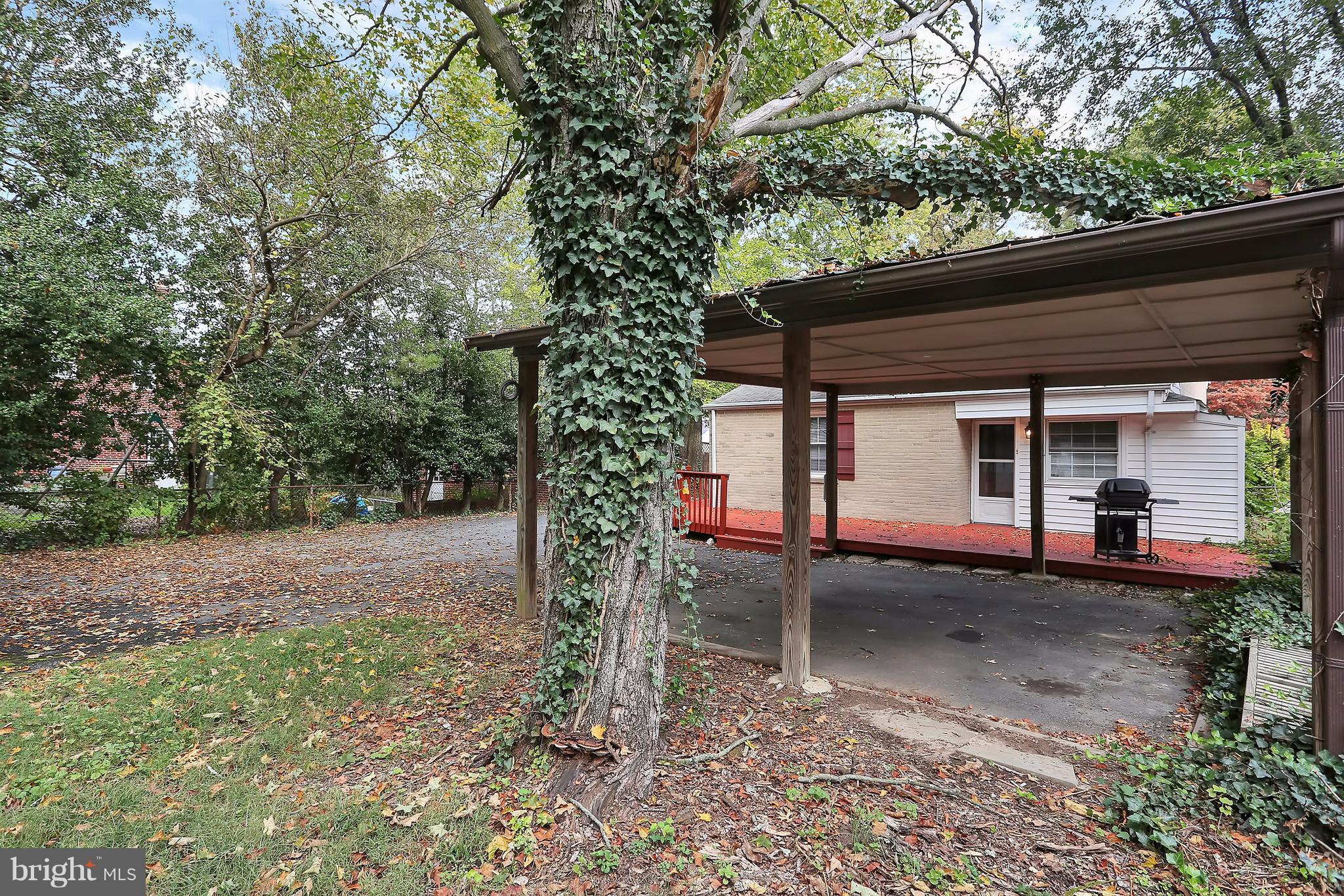 9408 Flower Avenue Silver Spring, MD 20901 - Photo 26 of 29 Rear view of carport and deck